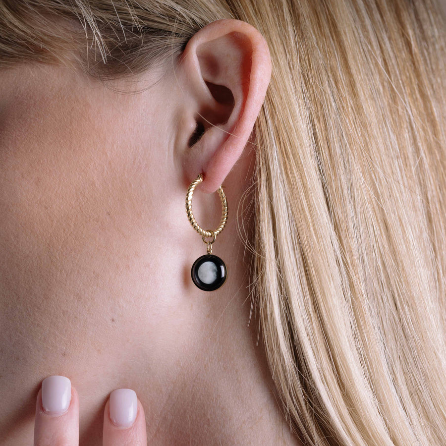Woman wearing The Carina Hoops in Gold