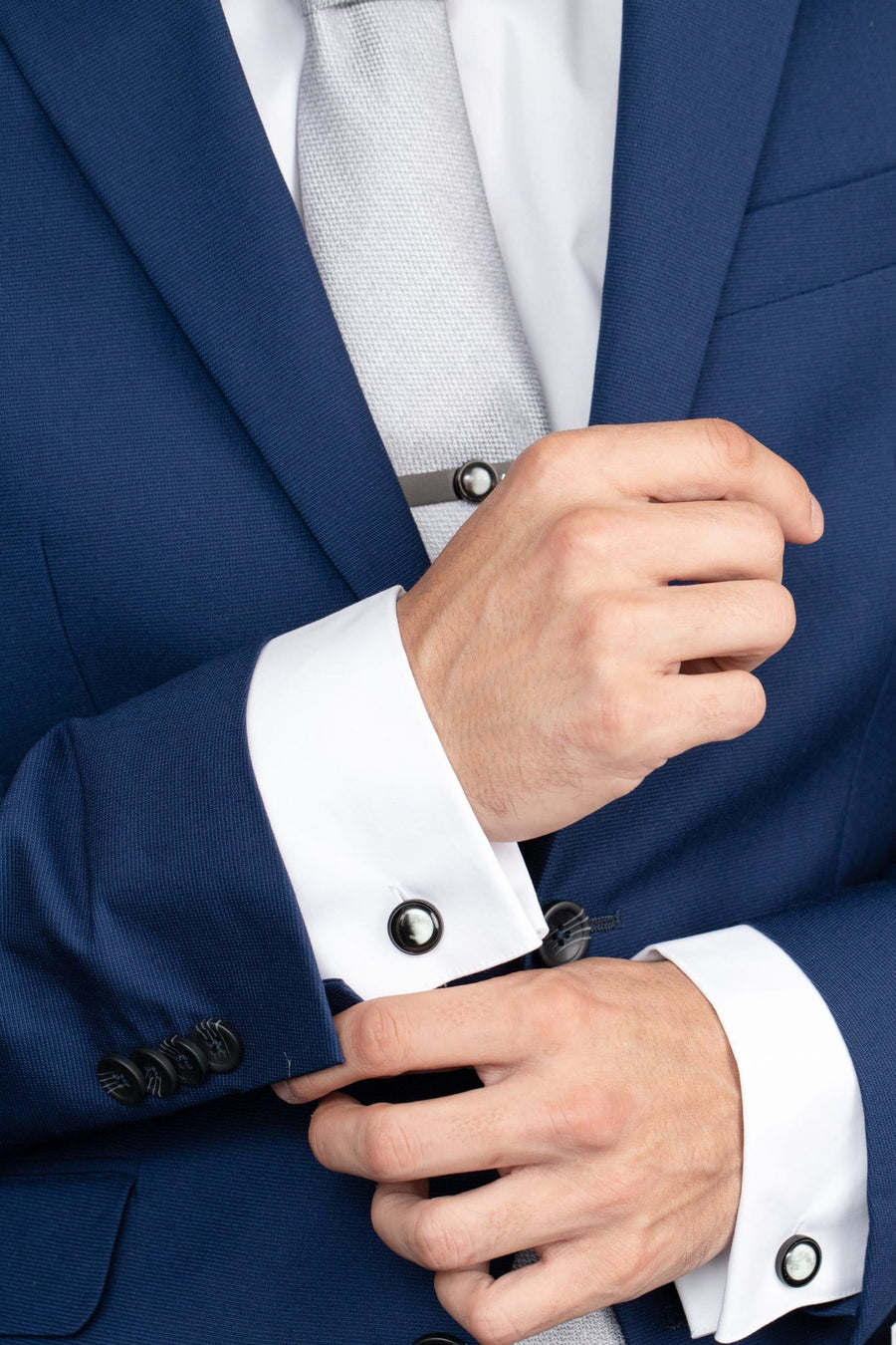 Man in a suit wearing The Maginus Cufflinks in Silver Stainless Steel