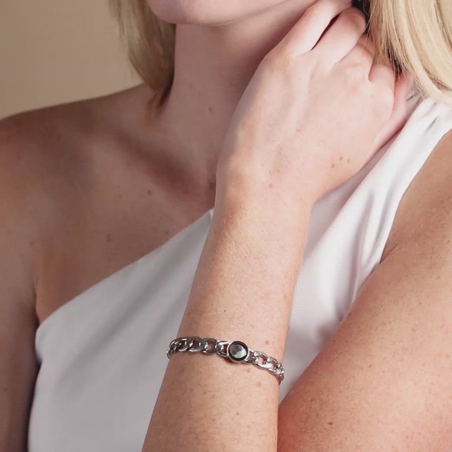 Video of woman wearing Moon phase link bracelet in stainless steel