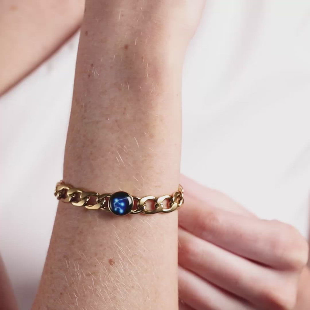 Video of woman wearing gold plated constellation astrology link bracelet