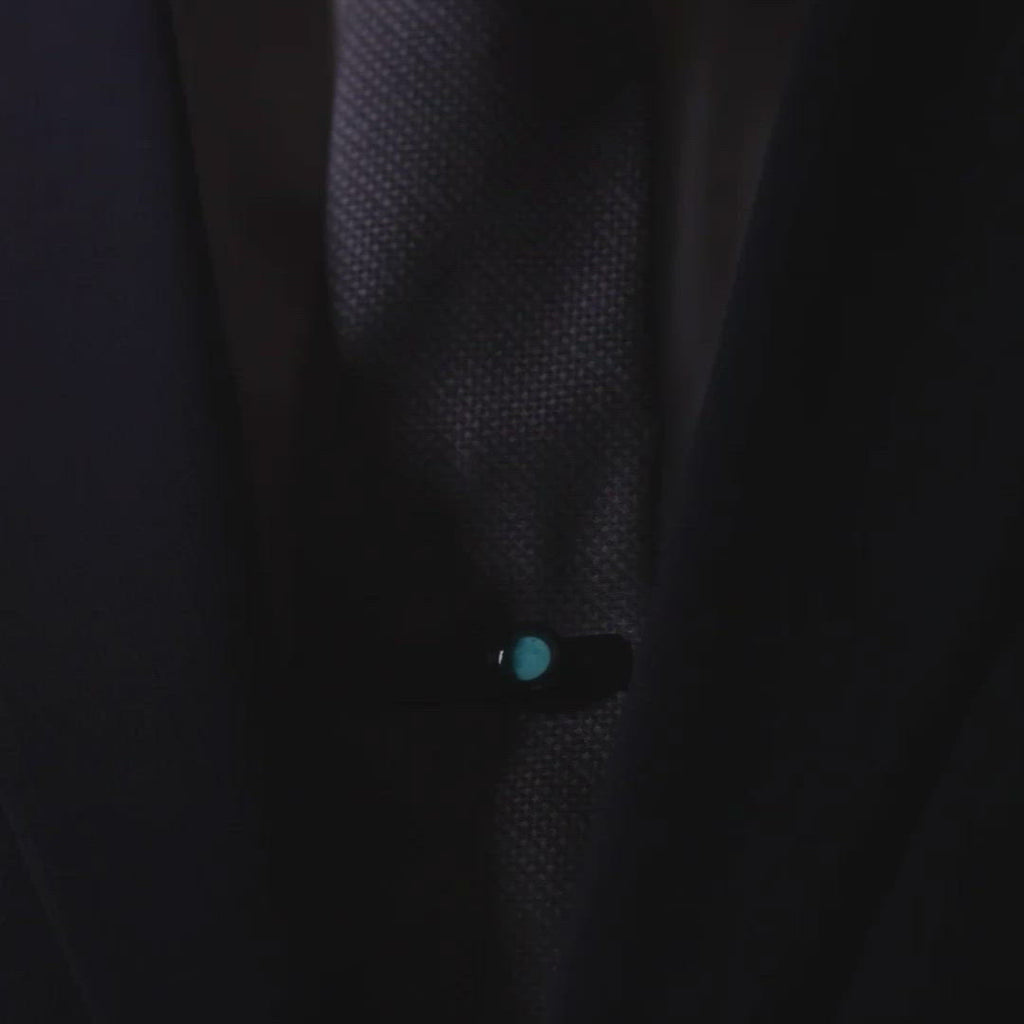 Video of man wearing glow in the dark moon phase tie bar in matte black stainless steel