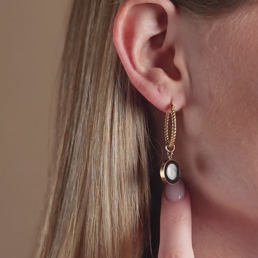 Video of woman wearing The Carina Hoops in Gold