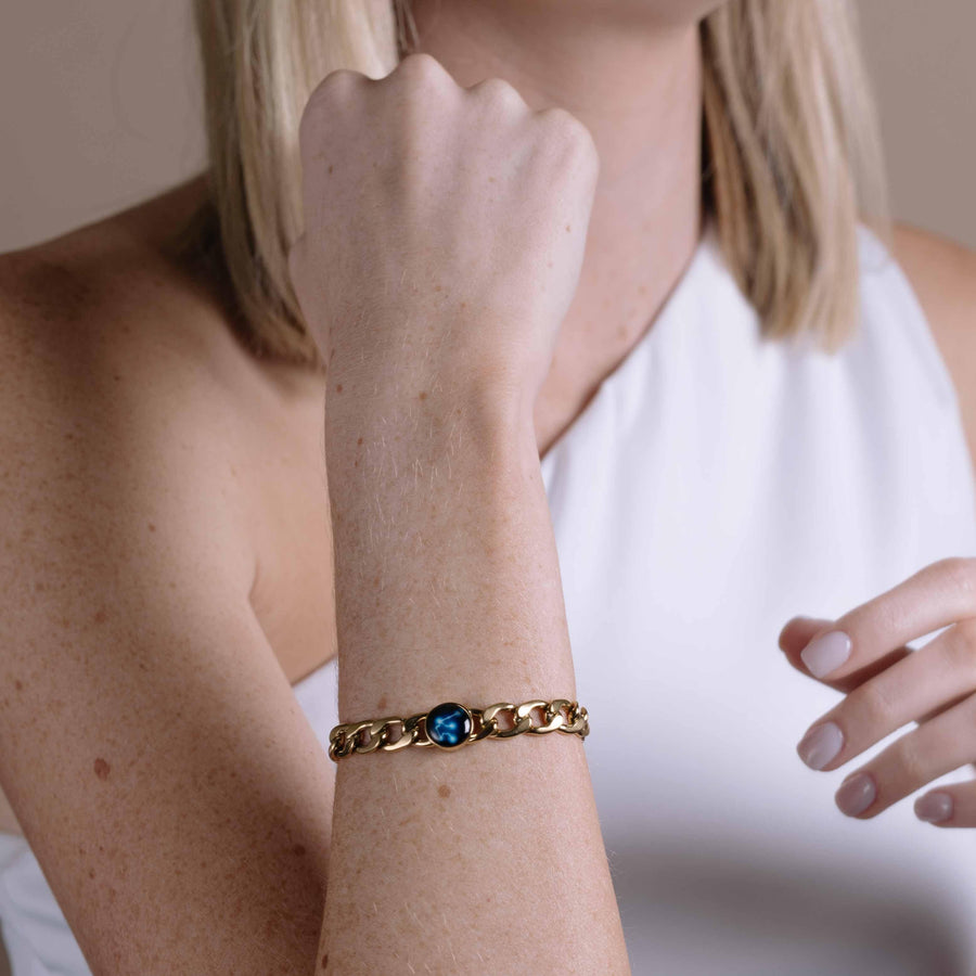 Woman wearing gold plated constellation astrology link bracelet