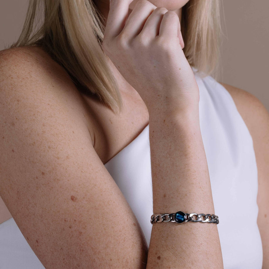 Woman wearing stainless steel constellation astrology link bracelet