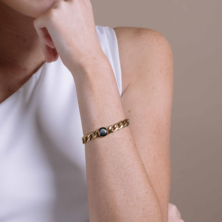 Woman wearing gold plated moon phase link bracelet