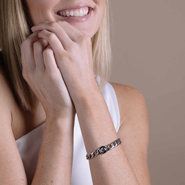 Woman wearing stainless steel link moon phase bracelet