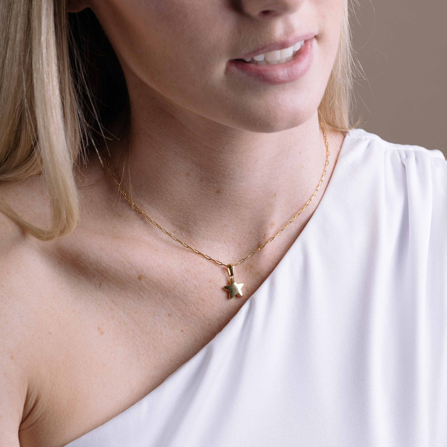 Woman wearing Star Bright Necklace  in Gold