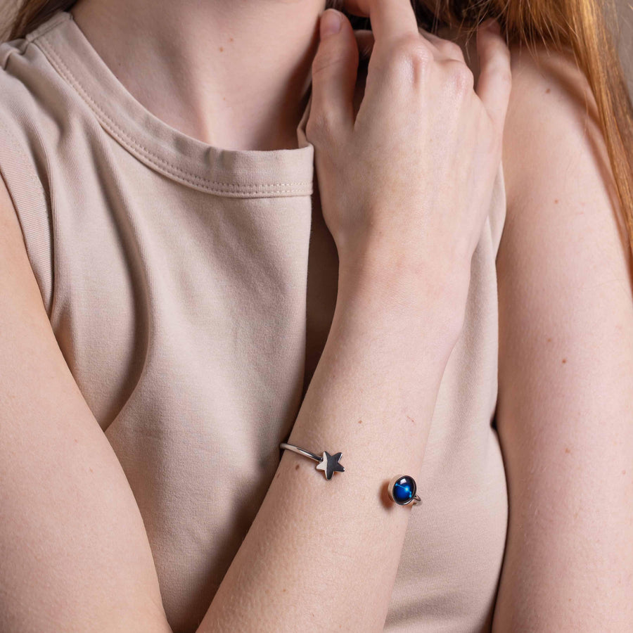 Woman wearing Stainless steel constellation astrology star cuff