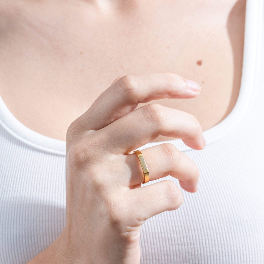 Woman wearing Engravable Ring in Gold