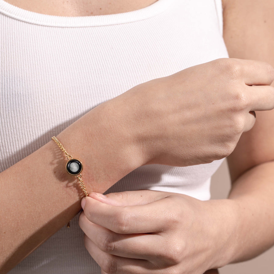 Woman wearing Pallene Bracelet in Gold