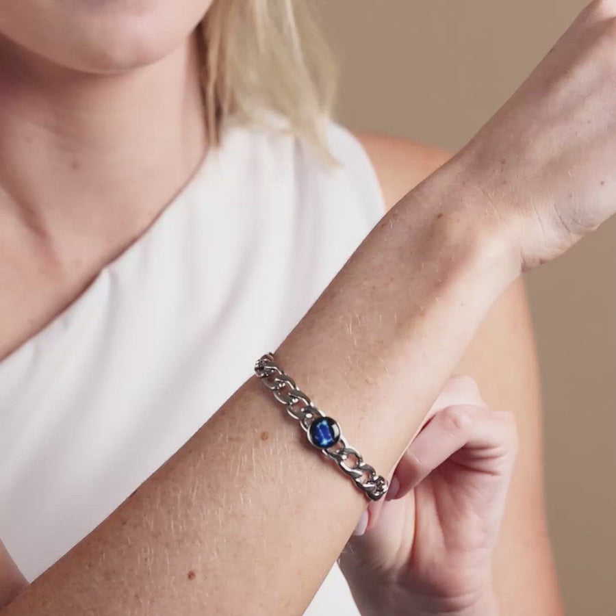 Video of woman wearing stainless steel constellation astrology link bracelet