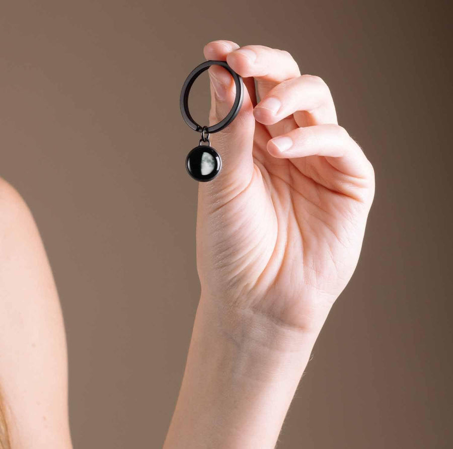 Woman holding Moon Memory Key Ring in Black