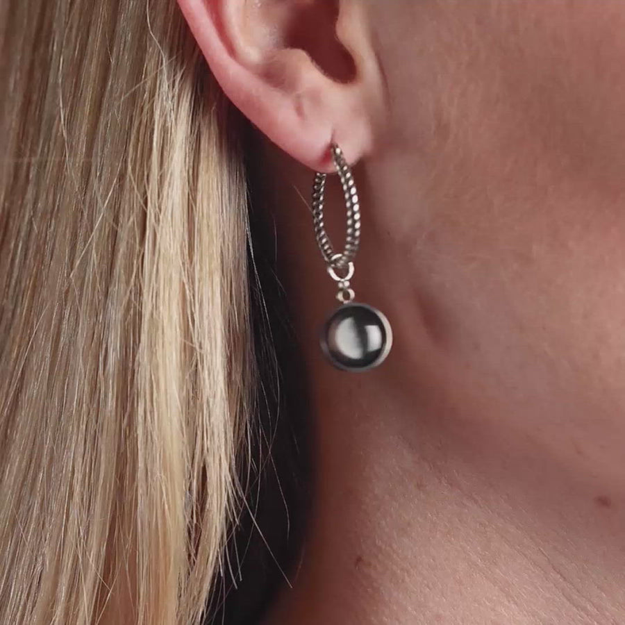 Video of woman wearing The Carina Hoops in Stainless Steel