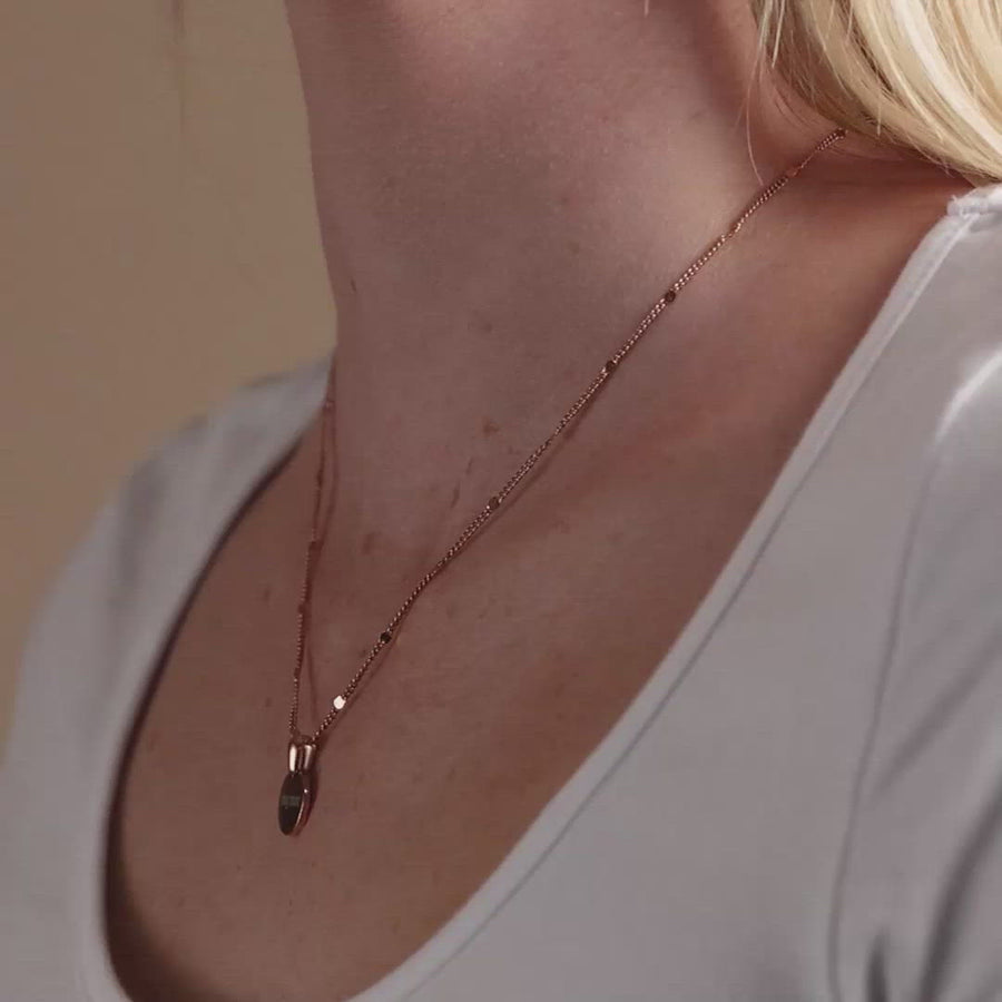 Video of woman wearing Sun Drop Engravable Necklace in Rose Gold