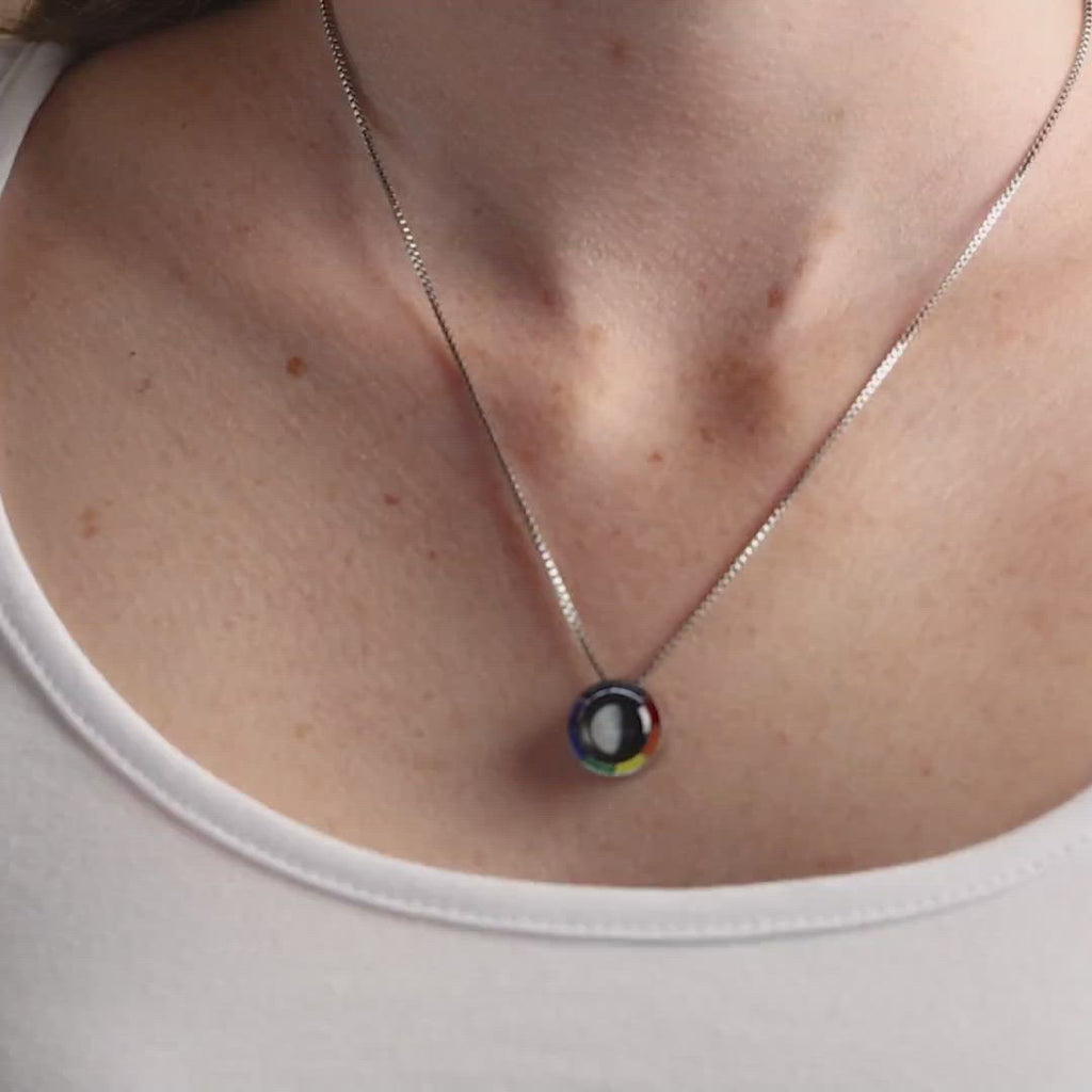 Video of woman wearing Pride necklace Moon charm