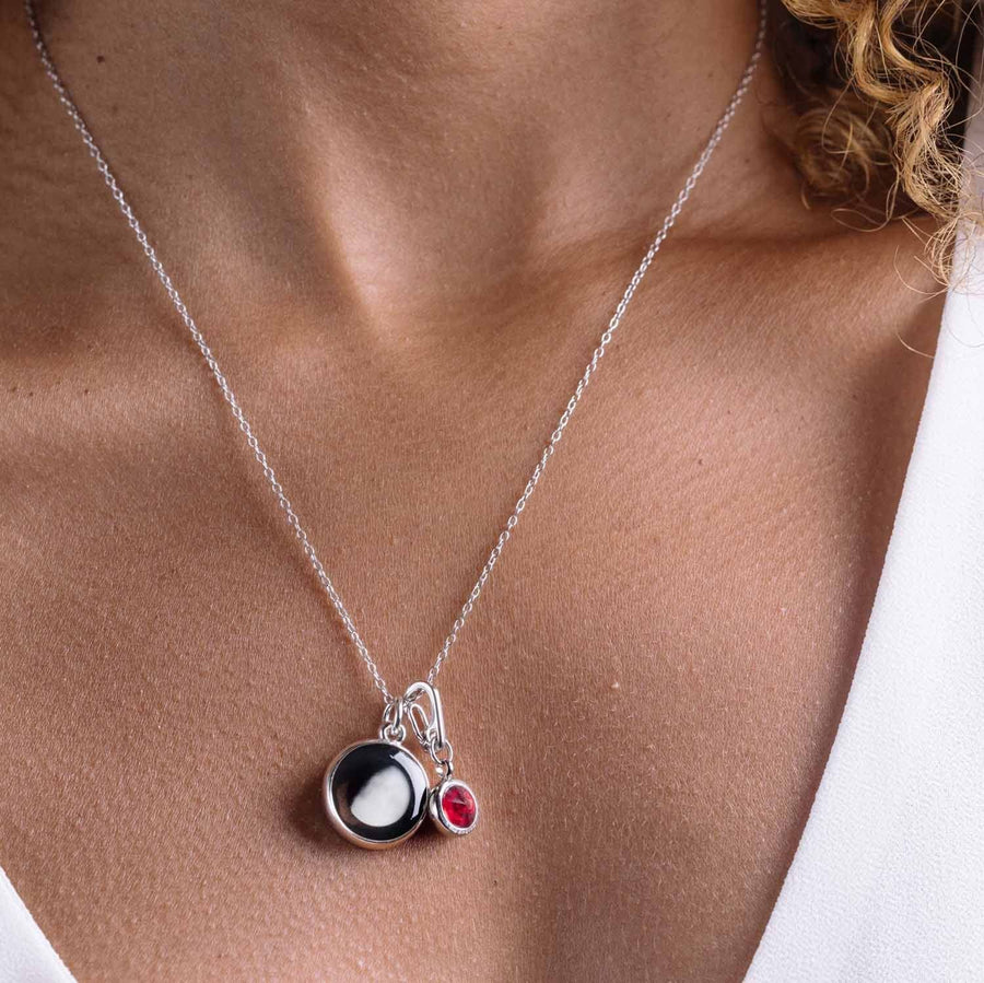 Woman wearing Moon phase charm with Duodecima Charms