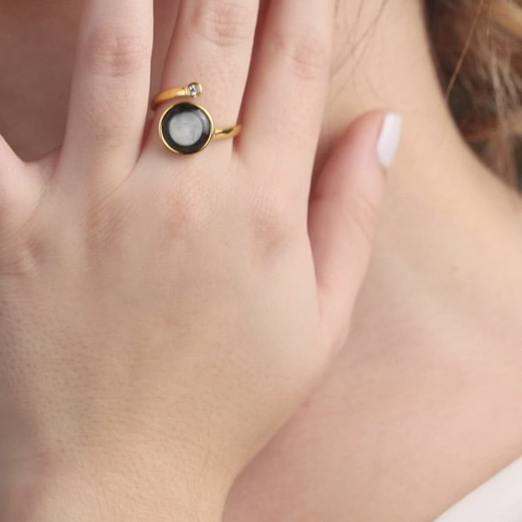 Video of woman wearing Moon phase Cosmic Spiral Ring in Gold