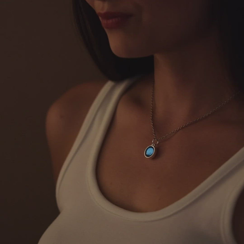 Video of woman wearing The Luna Mia Necklace in the dark. Glow in the dark.