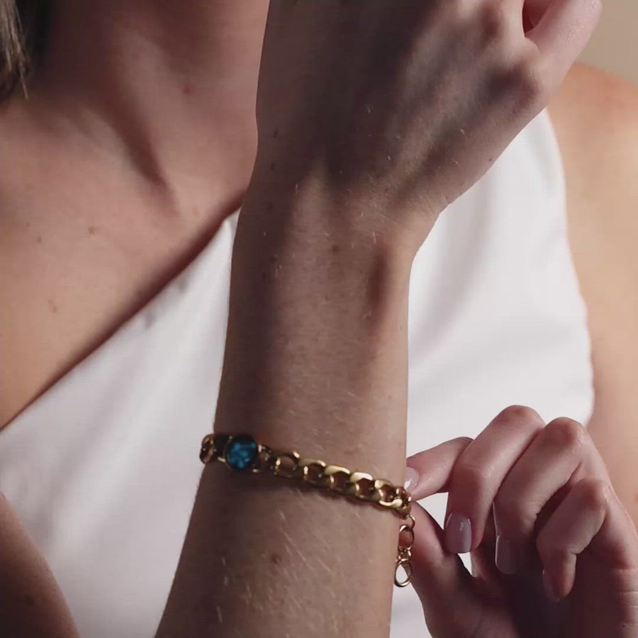 Video of woman wearing gold plated constellation astrology link bracelet