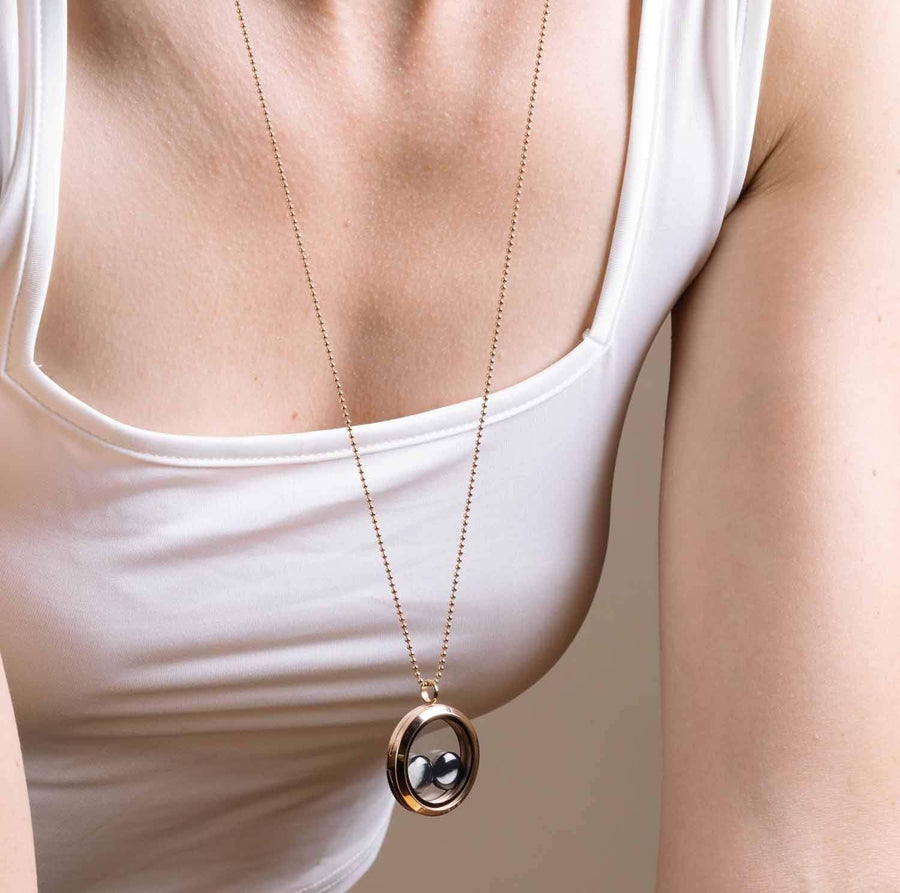 Woman wearing Lovers in the Locket in Gold