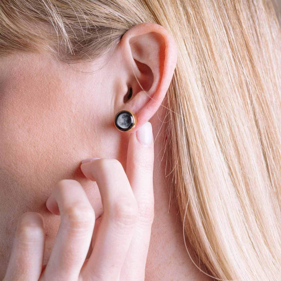 Woman wearing Moonshine Stud Earrings in Gold