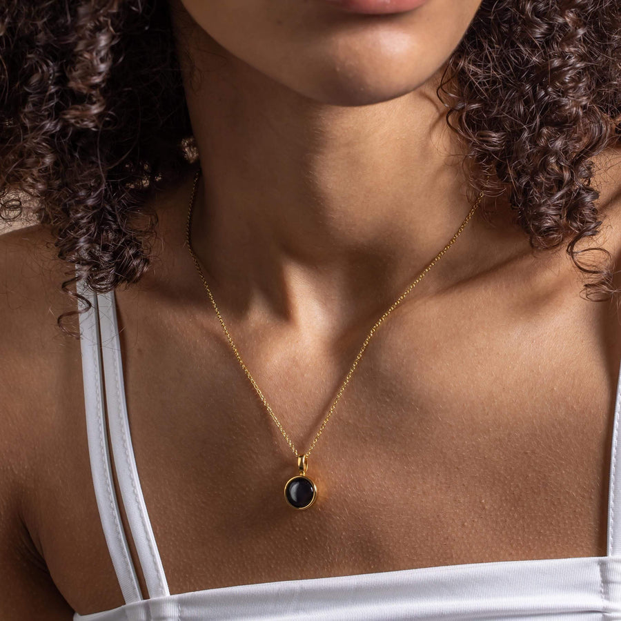 Girl in moon phase gold necklace