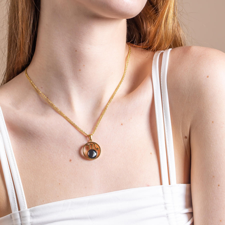 Woman wearing The Stella Necklace in Gold