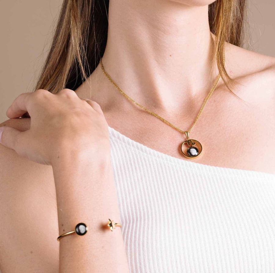 woman wearing Stella Necklace in Gold and Crépuscule Cuff in Gold